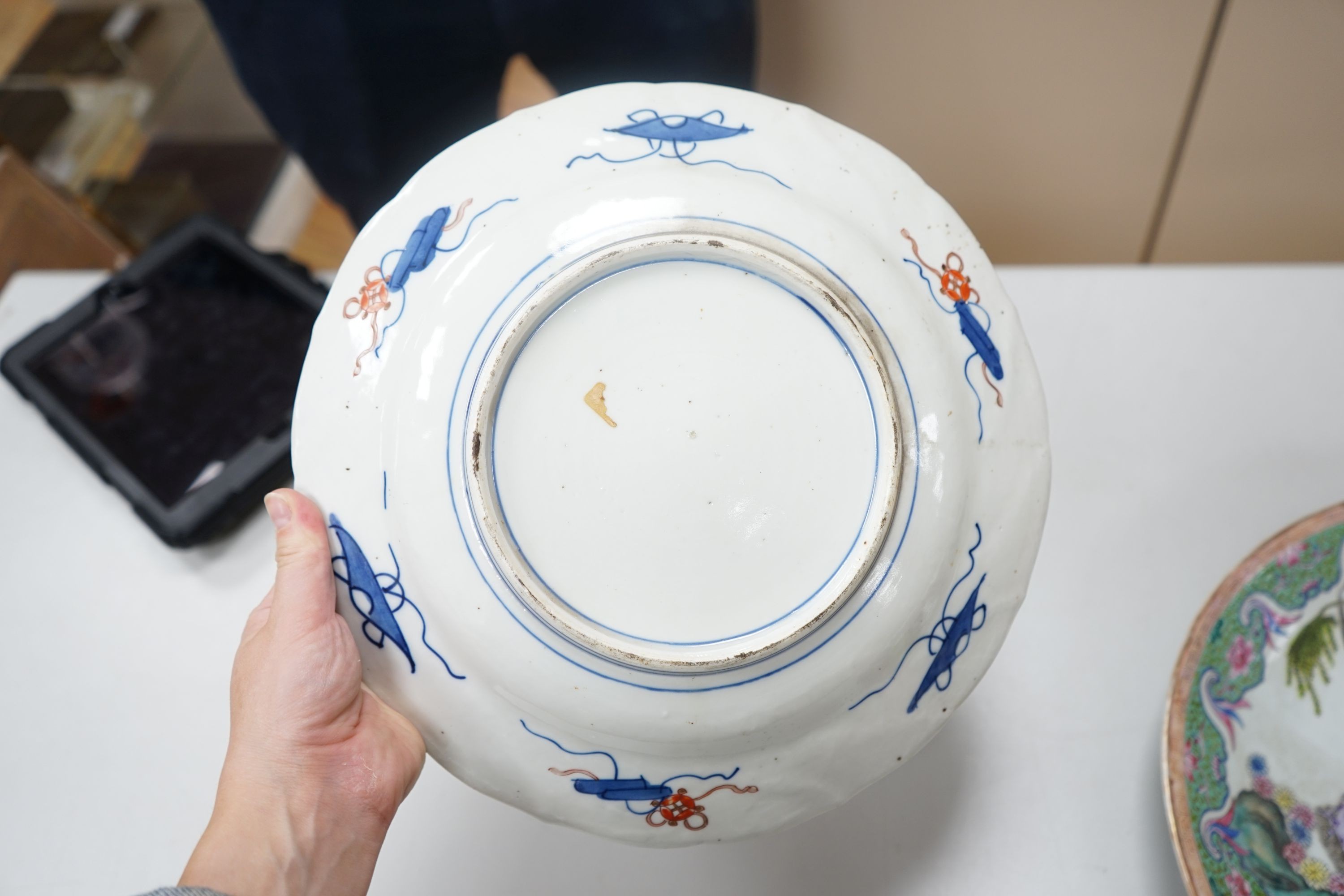 A 19th century Japanese Imari dish, 30cm and a damaged Chinese famille rose dish, 33.5cm 34cm